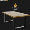A table with black metal legs against a black background, with text and an icon indicating weight capacity. Produktbild-Vorschau