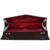 An open black clutch bag with a red interior, shown against a white background. Produktbild-Vorschau