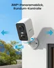 A white security camera mounted on a white wall, with blue arrows indicating its panoramic view and a blue circle showing a 300-degree rotation. Náhled obrázku produktu