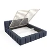 A blue upholstered bed frame with its slatted base lifted to reveal storage space underneath. Produktbild-Vorschau