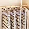A multi-tier hanger holding many folded pairs of pants, inside a closet. Produktbild-Vorschau