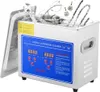 A digital ultrasonic cleaner with various items inside, such as jewelry and a wrench. Produktbild-Vorschau
