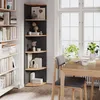 A corner shelf unit is shown next to a window with a dining table and chairs in a room. Podgląd zdjęcia produktu