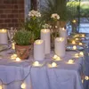 A table set for an outdoor evening gathering, decorated with LED candles and string lights. Náhled obrázku produktu