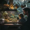 A father and son are looking at a fish tank in a room with plants. Náhled obrázku produktu