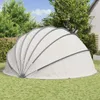 A dome-shaped pool cover is set up on a grassy lawn in a backyard setting. Anteprima dell’immagine prodotto