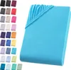 A folded turquoise fitted sheet is shown on the right side of the image, with a grid of smaller swatches of various colored fitted sheets on the left. Produktbild-Vorschau