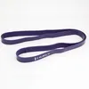 A purple fitness band is laid out on a white background. Produktbild-Vorschau