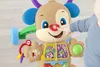 A baby's hand is touching the nose of a Fisher Price dog walker toy. Podgląd zdjęcia produktu