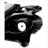 A close-up, angled view of the bottom of a black manual sweeper, showing its brushes and wheels against a white background. Podgląd zdjęcia produktu