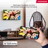A living room scene with a TV displaying children and a hand holding a smartphone mirroring the TV content, promoting content sharing. Produktbild-Vorschau