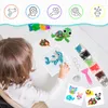 A child is playing with a water bead art set on a table, creating animal figures. Náhled obrázku produktu