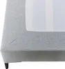 A close-up view of the corner of a light gray upholstered bed frame with a white mattress visible. Produktbild-Vorschau