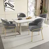 A dining set with four chairs around a marble-top table in a modern room. Náhled obrázku produktu