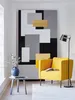 A modern living room scene with a yellow armchair, a large abstract painting, and a floor lamp. Produktbild-Vorschau