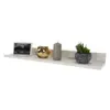 A white floating shelf with decorative items on it. Náhled obrázku produktu