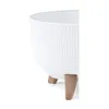 A close-up view of a white planter with a ribbed texture and three wooden legs, set against a white background. Náhľad obrázku produktu