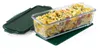 A glass baking dish filled with pasta and vegetables, placed on a green mat next to its dark green lid. Produktbild-Vorschau