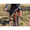 A person riding a mountain bike outdoors. Náhľad obrázku produktu