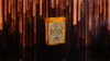 A deck of Bicycle Bourbon playing cards is shown against a background of blurred orange and brown streaks. Náhľad obrázku produktu