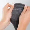 Hands holding a grey sock. Produktbild-Vorschau