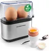 A close-up product shot of an electric egg cooker, displaying two brown eggs inside the transparent lid and a single soft-boiled egg in an egg cup. Produktbild-Vorschau