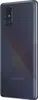 The back of a black Samsung Galaxy A71 smartphone is shown from a diagonal angle. Podgląd zdjęcia produktu
