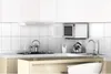 A clean, modern kitchen counter with appliances and cabinets. Náhľad obrázku produktu