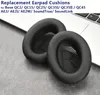 Two black earpad cushions are placed on a laptop keyboard and a textured surface. Produktbild-Vorschau