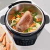 A close-up overhead view of a multi-cooker with a roast and vegetables inside. Anteprima dell’immagine prodotto