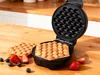 A waffle maker with freshly made bubble waffles and berries on a wooden table. Náhľad obrázku produktu