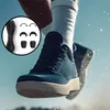 A person's leg wearing a blue shoe and white sock is jumping, with a small inset image showing black shoelaces and accessories. Náhled obrázku produktu