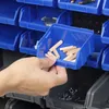 A hand is shown reaching into a blue storage bin filled with wooden dowels, which is part of a larger storage system. Anteprima dell’immagine prodotto