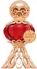 A perfume bottle with intricate gold detailing and a red glass body, presented on a white background. Anteprima dell’immagine prodotto