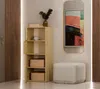 A hallway or entryway scene with a tall, narrow cabinet, a mirror, and a pouf. Voir les images du produit