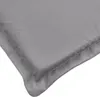 A close-up view of the corner of a gray cushion or mat, showing the stitching and fabric texture. Voir les images du produit