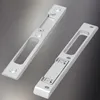 Two silver door strike plates are shown on a gradient gray background. Podgląd zdjęcia produktu