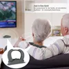 An elderly couple sitting on a couch watching TV, with a product overlay showing a close-up of the device. Produktbild-Vorschau