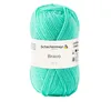 A ball of green yarn with a label. Podgląd zdjęcia produktu