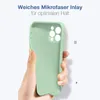 A hand holding a light green phone case against a white background. Produktbild-Vorschau