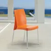 An orange chair with silver legs is placed on a light-colored floor in front of a large window overlooking a body of water and distant hills. Anteprima dell’immagine prodotto