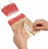 Hands are shown adjusting a doll's costume, which includes a top and a skirt with fringe. Náhľad obrázku produktu