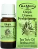 A bottle of tea tree oil and its packaging are shown side-by-side. Produktbild-Vorschau