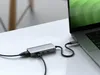 A Satechi USB-C hub is connected to a laptop on a white desk. Náhľad obrázku produktu