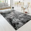 A modern living room with a sofa, rug, and dining set. Produktbild-Vorschau