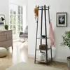 A hallway or entryway scene featuring a coat rack with shelves. Produktbild-Vorschau
