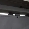 A close-up view of a metal bracket and screw attaching two black metal components. Produktbild-Vorschau