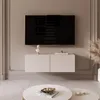 A modern living room with a wall-mounted TV and media console. Voir les images du produit
