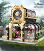 A detailed model of a botanical garden building, likely a toy or display piece, set against a blurred natural background. Anteprima dell’immagine prodotto