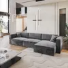 A modern living room with a large sectional sofa, coffee table, and abstract wall art. Produktbild-Vorschau